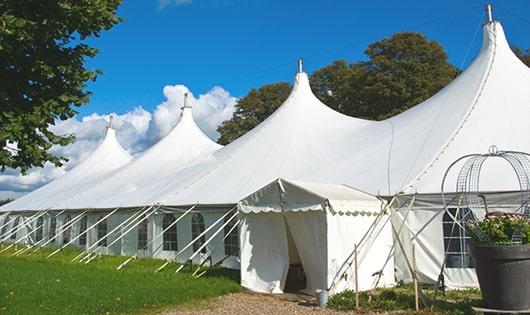 high-quality portable toilets stationed at a wedding, meeting the needs of guests throughout the outdoor reception in Malakoff